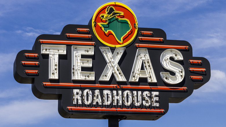 Texas Roadhouse sign against blue sky