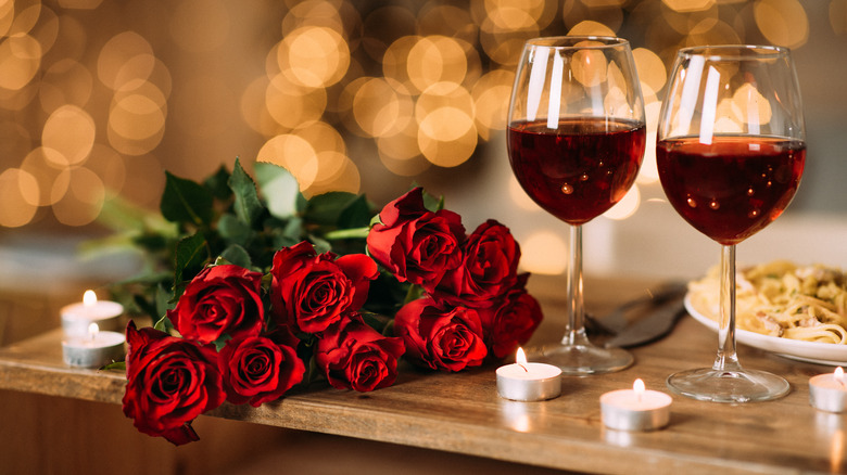 roses and wine at table