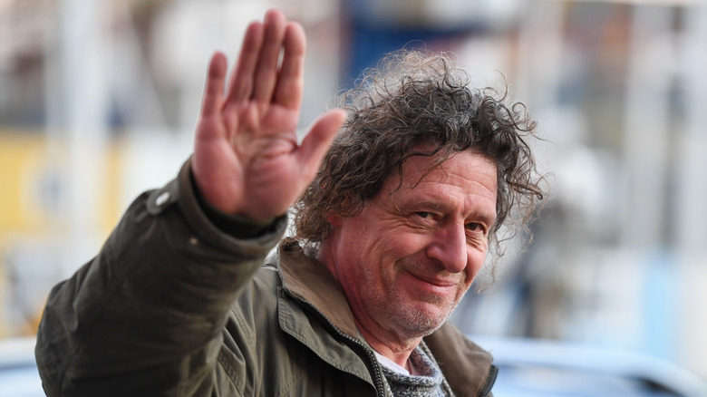 Marco Pierre White raising his hand