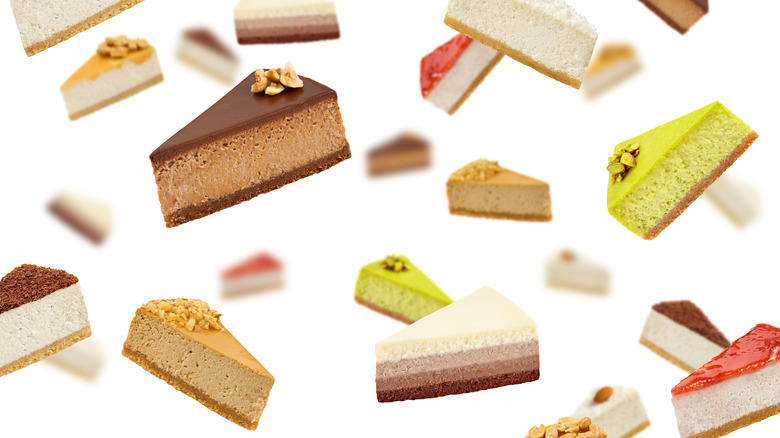 A variety of cheesecake slices floating against white background