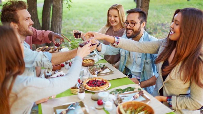 friends toasting at Thanksgiving dinner