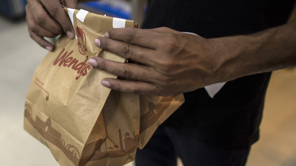 A Wendy's employee packing food