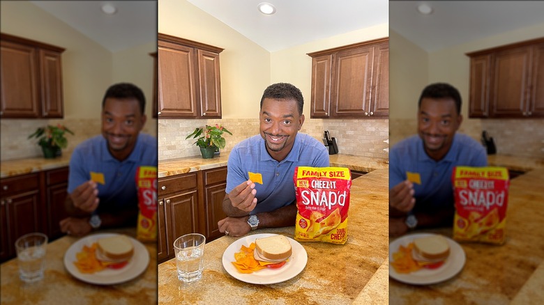 Alfonso Ribeiro with a sandwich and a bag of Cheez-Its Snap'd