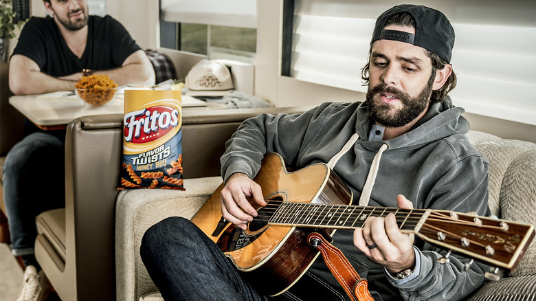 Thomas Rhett with bag of Fritos