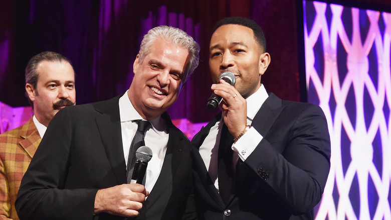 eric ripert and john legend on stage