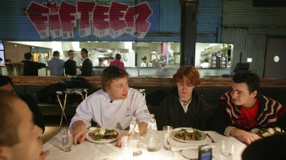 Jamie Oliver eating dinner at Fifteen Amsterdam with guests