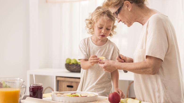 woman cooking with child