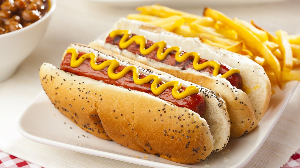 hot dogs with mustard, chili, and french fries