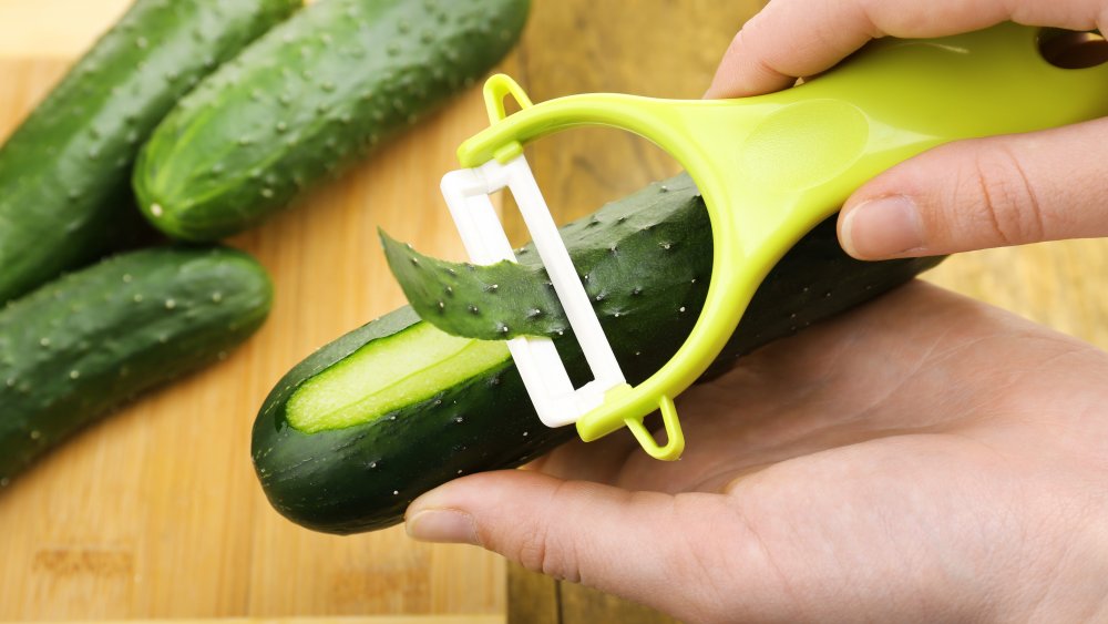 cucumber being peeled