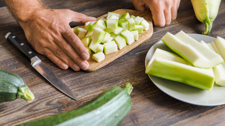 chopping and preparing zucchini 