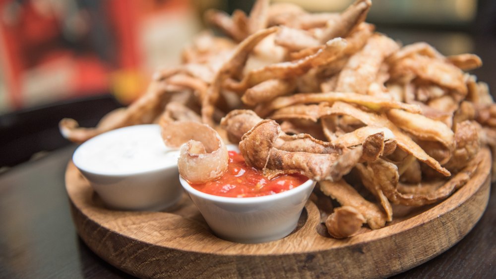 fried potato peels with dips