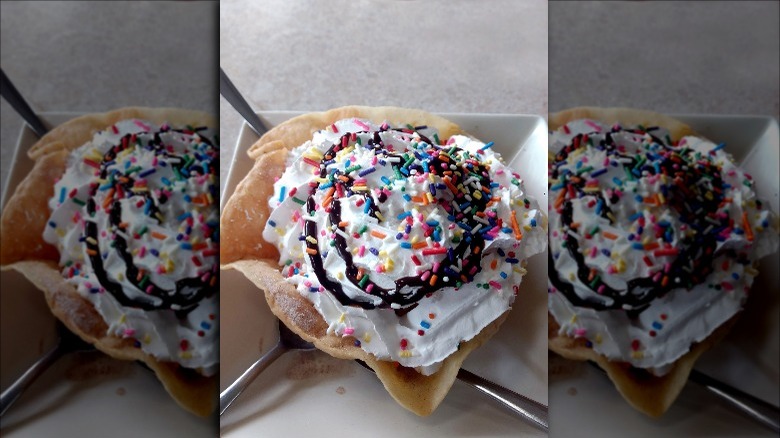 Ice cream in fried shell with chocolate sauce and sprinkles