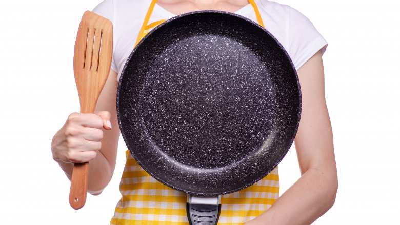 woman with frying pan