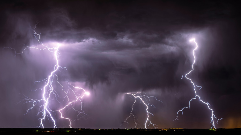 Thunderstorm with lightning against a purplish sky