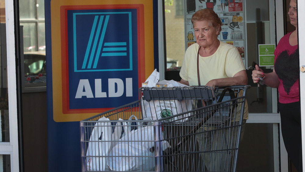 Aldi shopper exiting the store