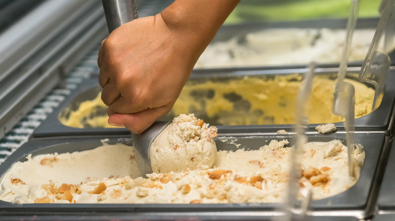 hand scooping ice cream