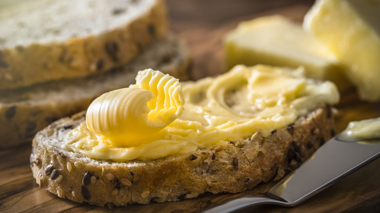 butter spread on grain bread