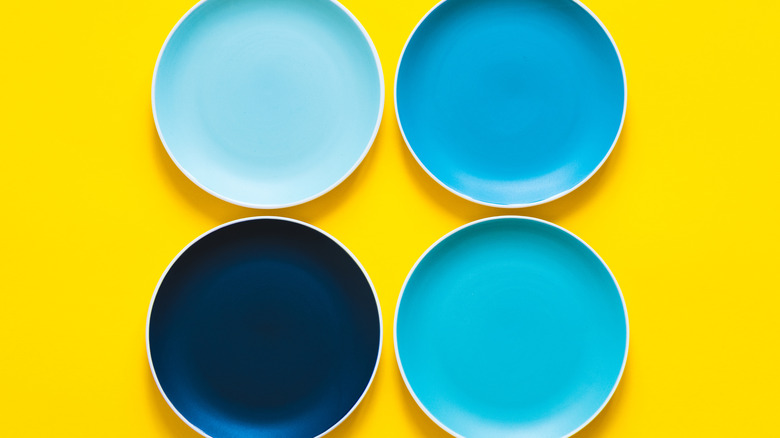 Four blue dinner plates