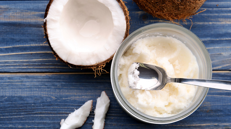 Coconut oil on wooden background