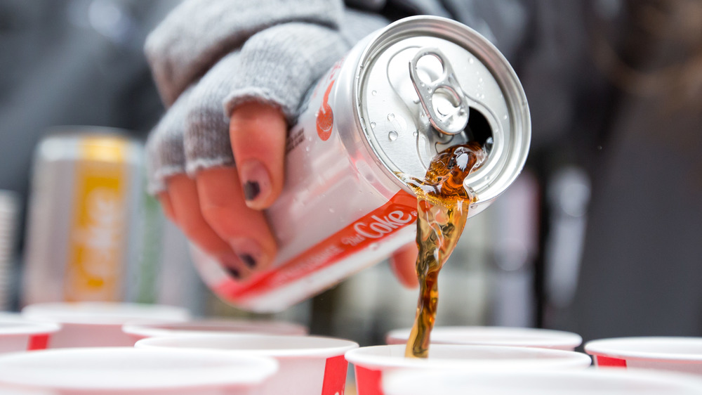 Diet Coke can pouring