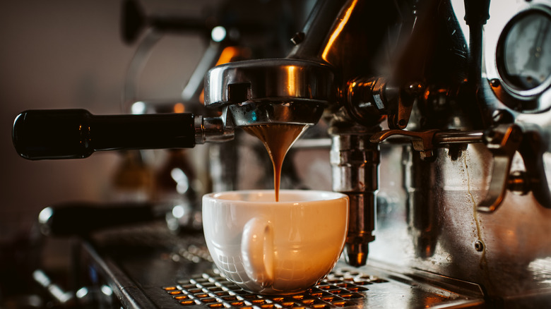 espresso dripping from machine