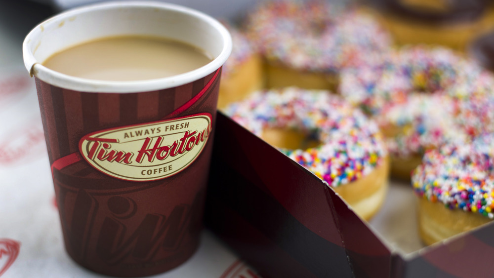 A box of donuts and coffee from Tim Hortons