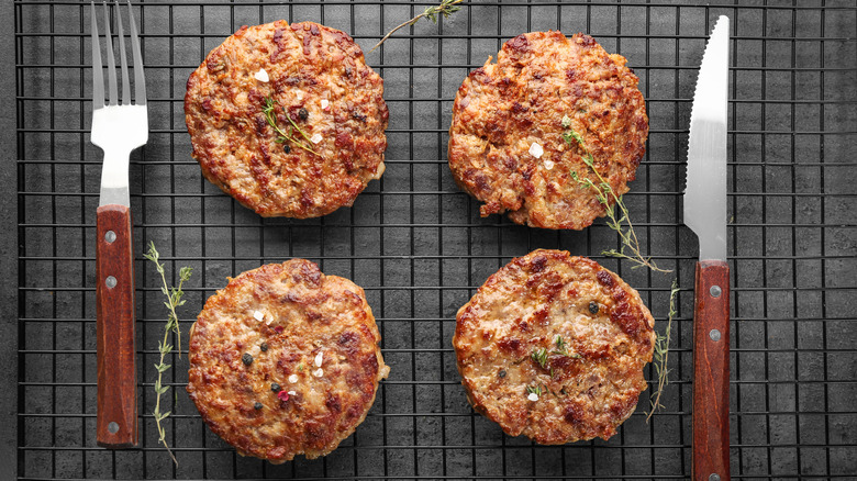 Hamburgers with fork and knife