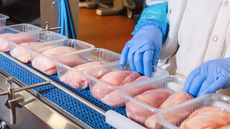 packaging chicken in a factory