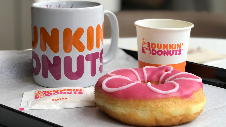 Dunkin' Donuts coffee mug and pink donut