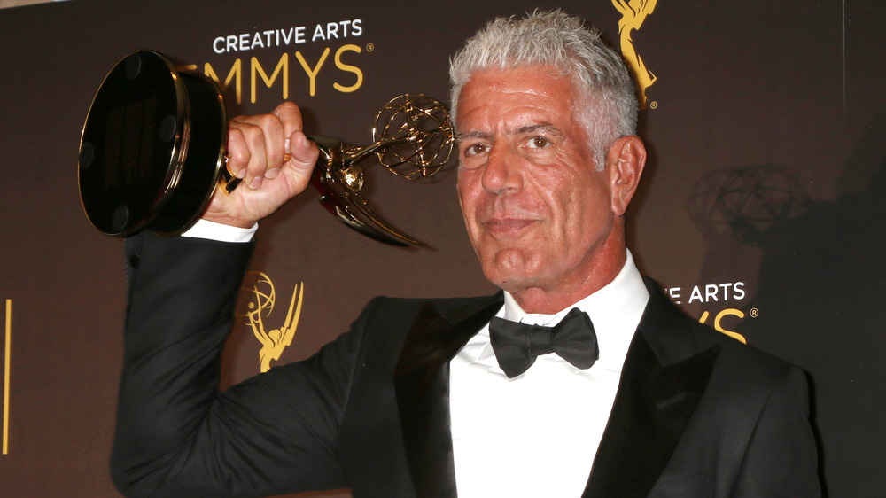 Anthony Bourdain with an Emmy Award