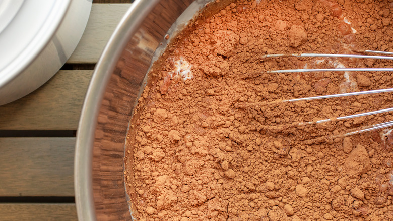 A bowl of lumpy cocoa powder