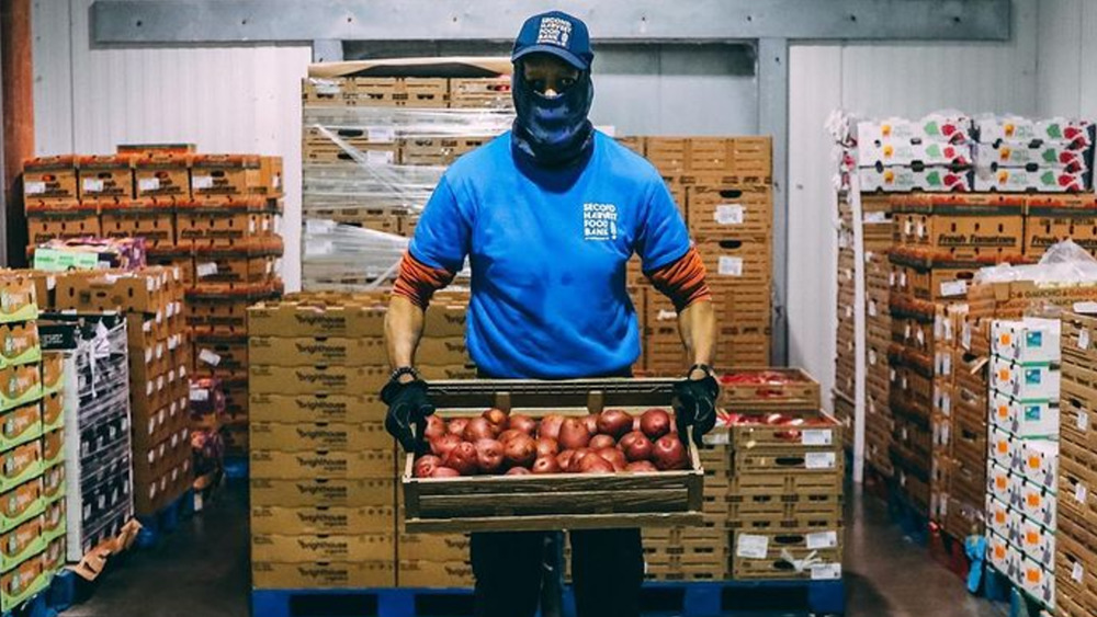 Walmart worker holding crate