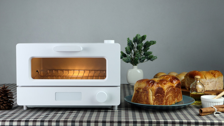 White microwave oven next to brioche bread