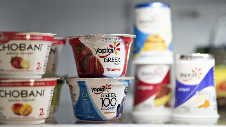 Series of stacked yogurts in fridge