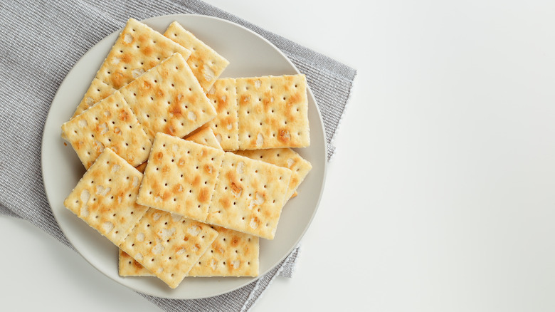 saltine crackers on a white plate