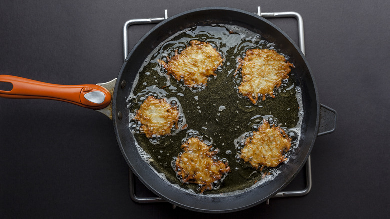 Latkes frying in oil