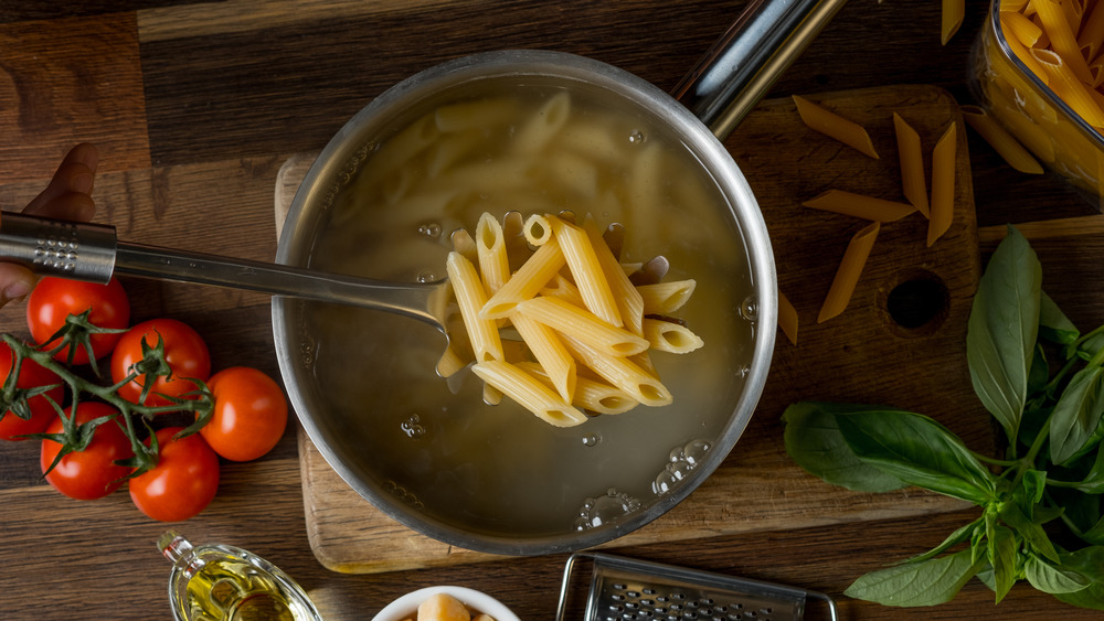 pot of penne pasta and water