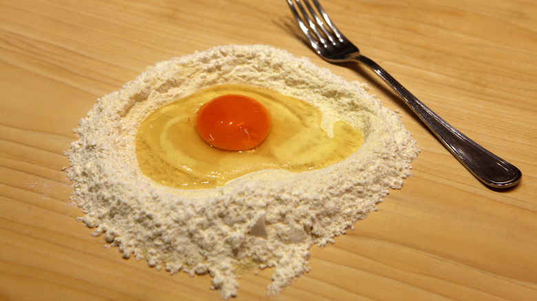 Egg Cracked into Flour