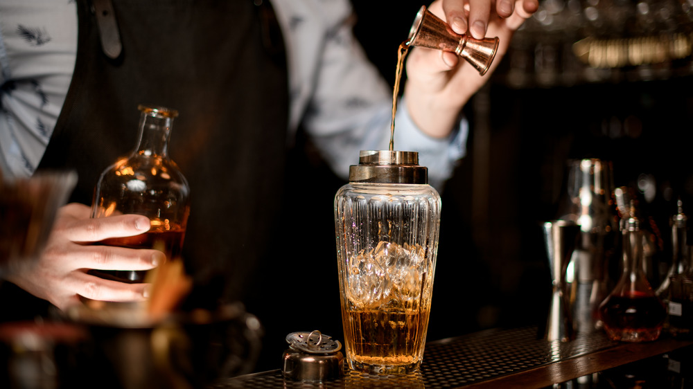 Bartender pouring alcohol