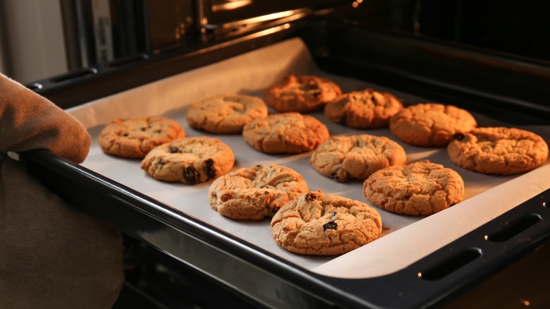 taking cookies out of the oven