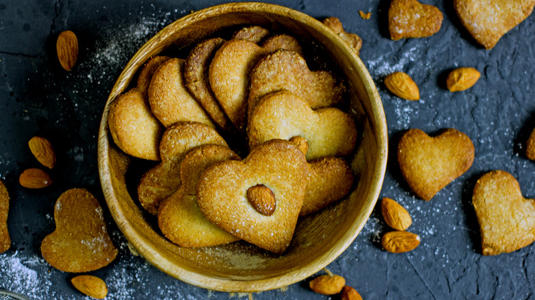 Heart-shaped cookies in round container