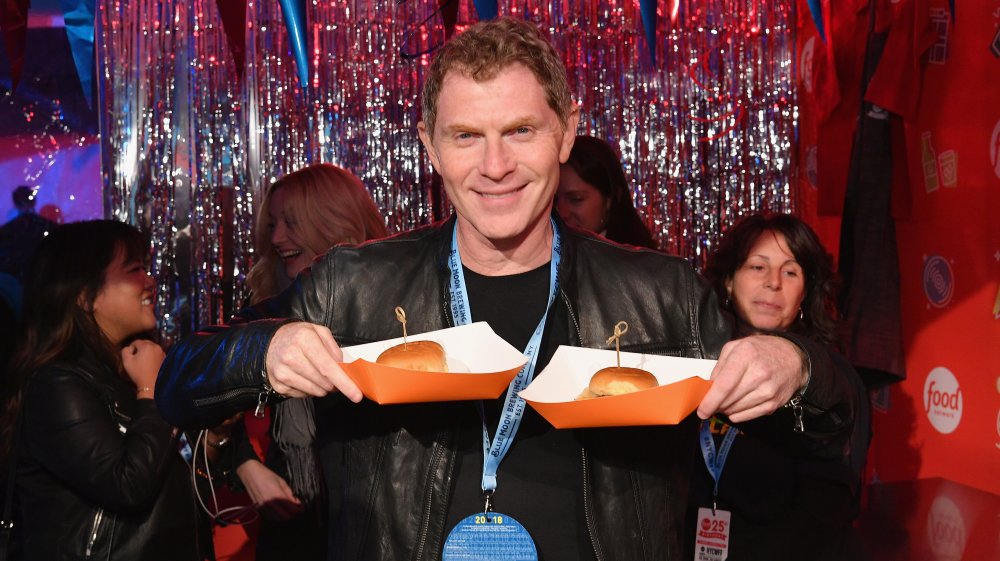 Bobby Flay holds sliders