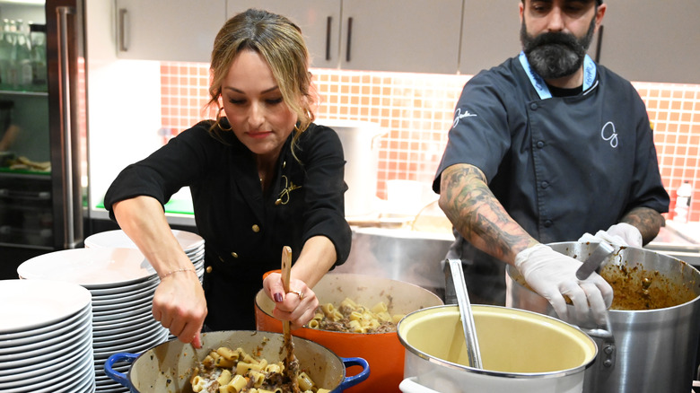 Giada De Laurentiis and chef cooking pasta