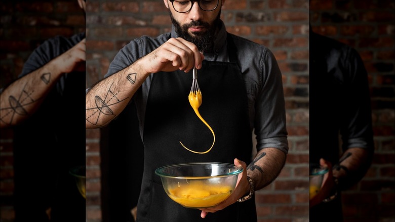 Andrew Rea whisking eggs