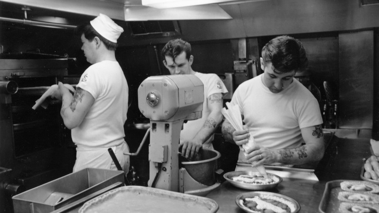 Sailors working in a submarine galley