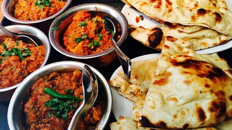 naan and curry served in the light of india balti house