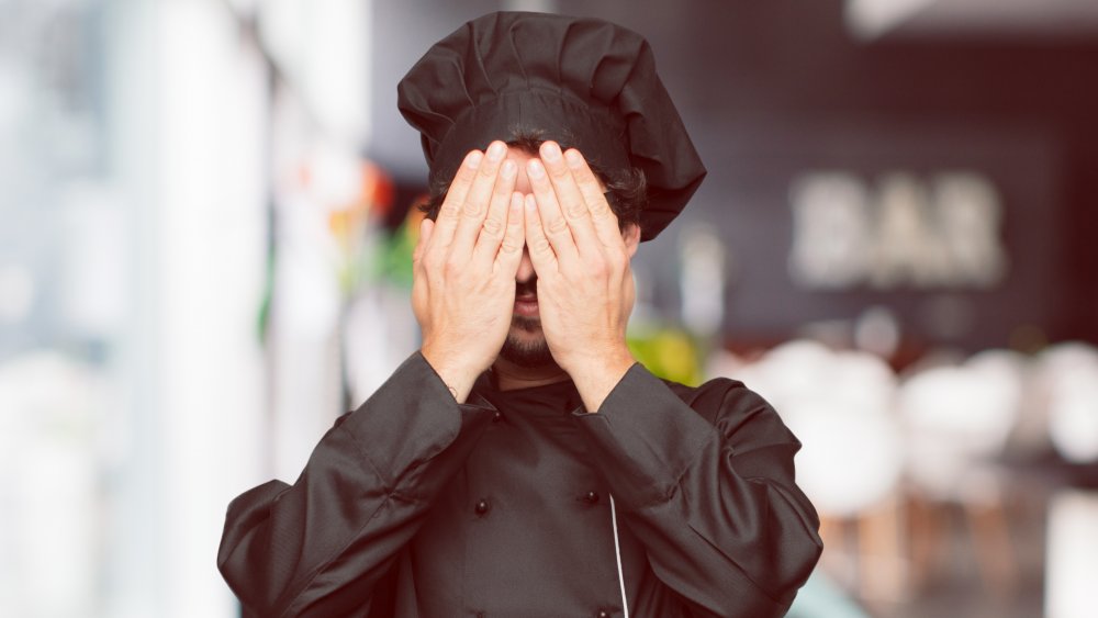 Chef covering eyes