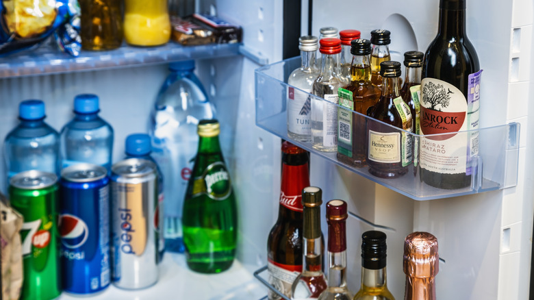 Mini fridge filled with bottles