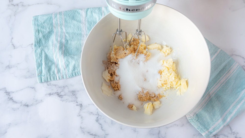 creaming butter and sugar for rich double chocolate chip cookies