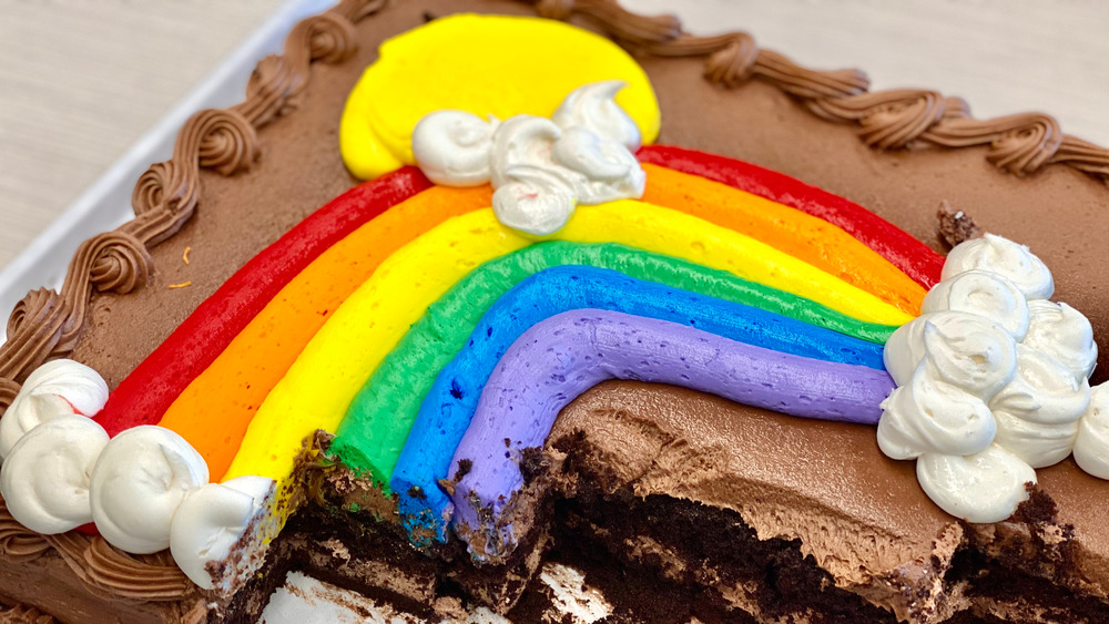 Chocolate cake with rainbow frosting on it